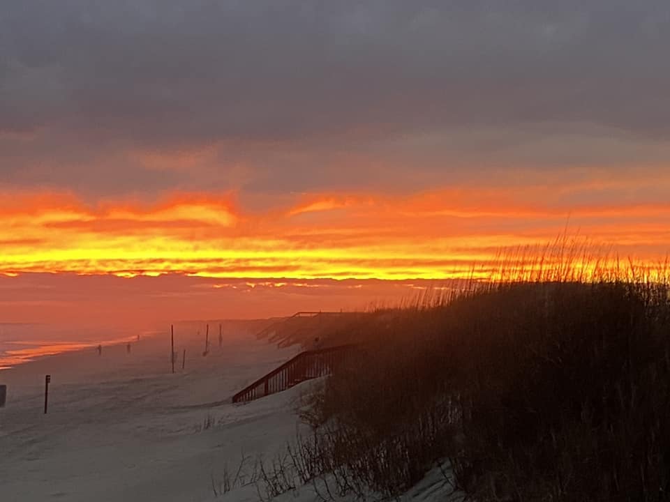 Fiery sunset over the dunes at Sunset Beach