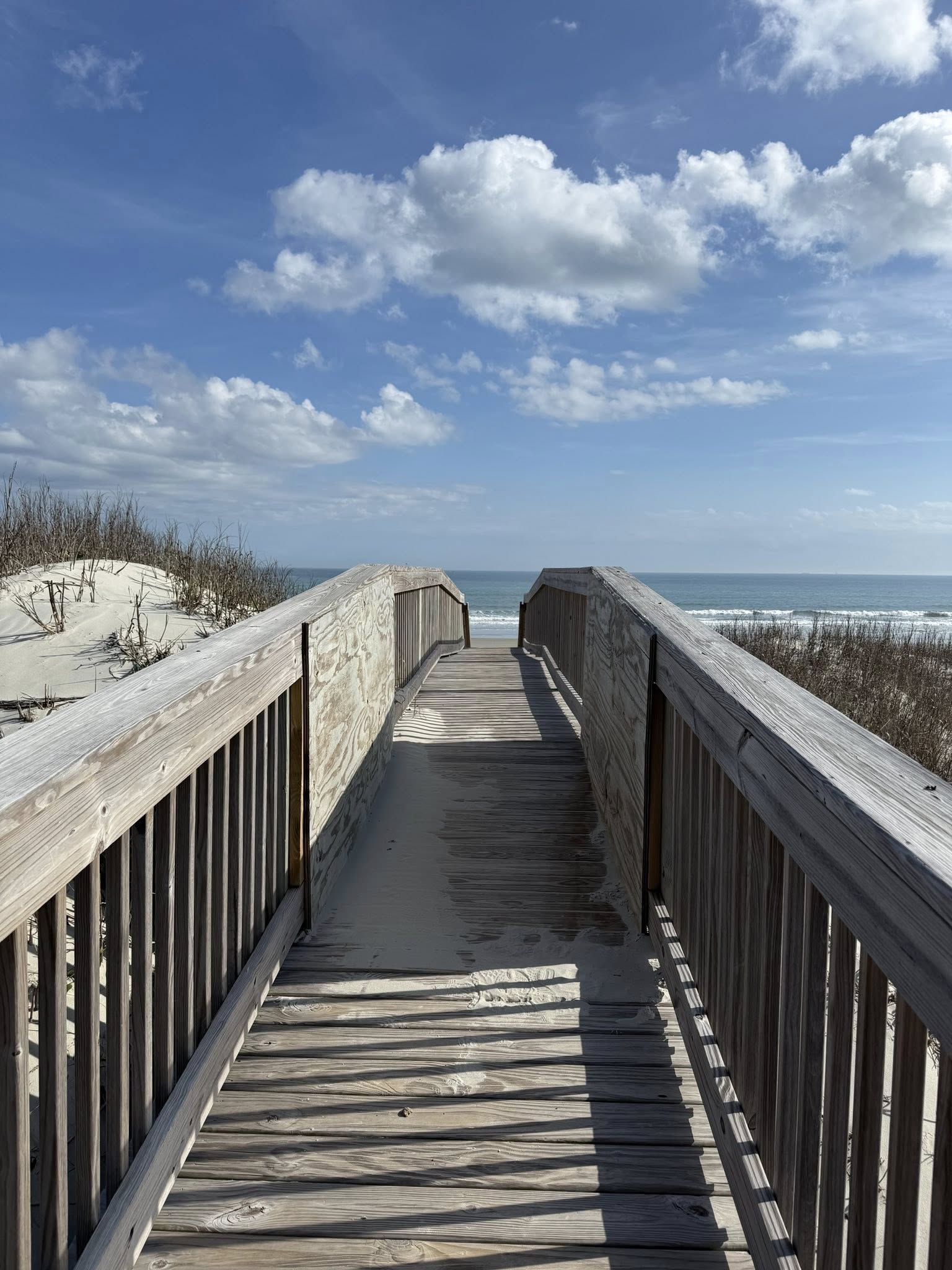 Wooden boardwalk leading to the ocean at Sunset Beach, NC